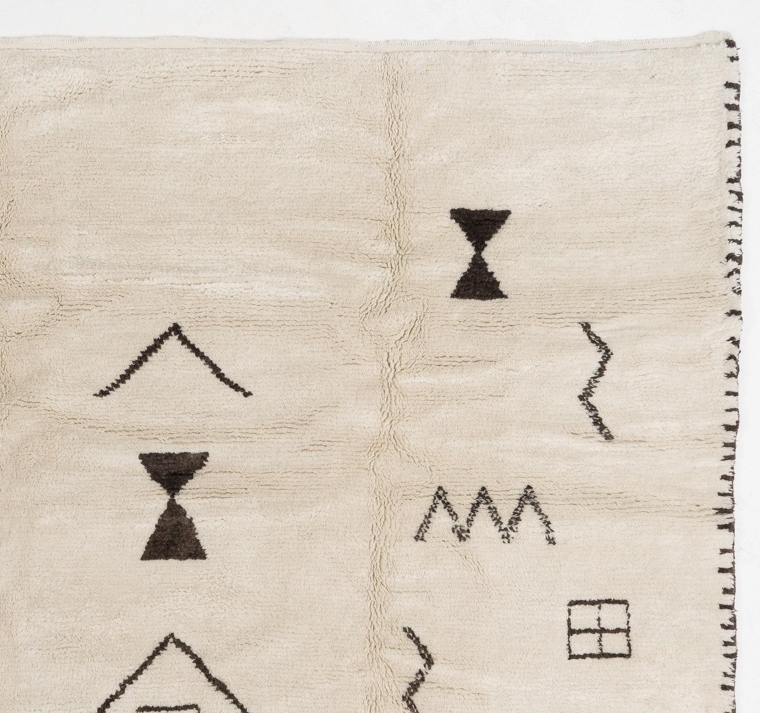 A contemporary hand-knotted Moroccan rug, made of plant dyed sheep wool. Size: 9 x 12 Ft.
Soft, comfy pile that is ideal for families with kids.
The rug can be custom produced in a different size, color combination, any pattern and weave any design