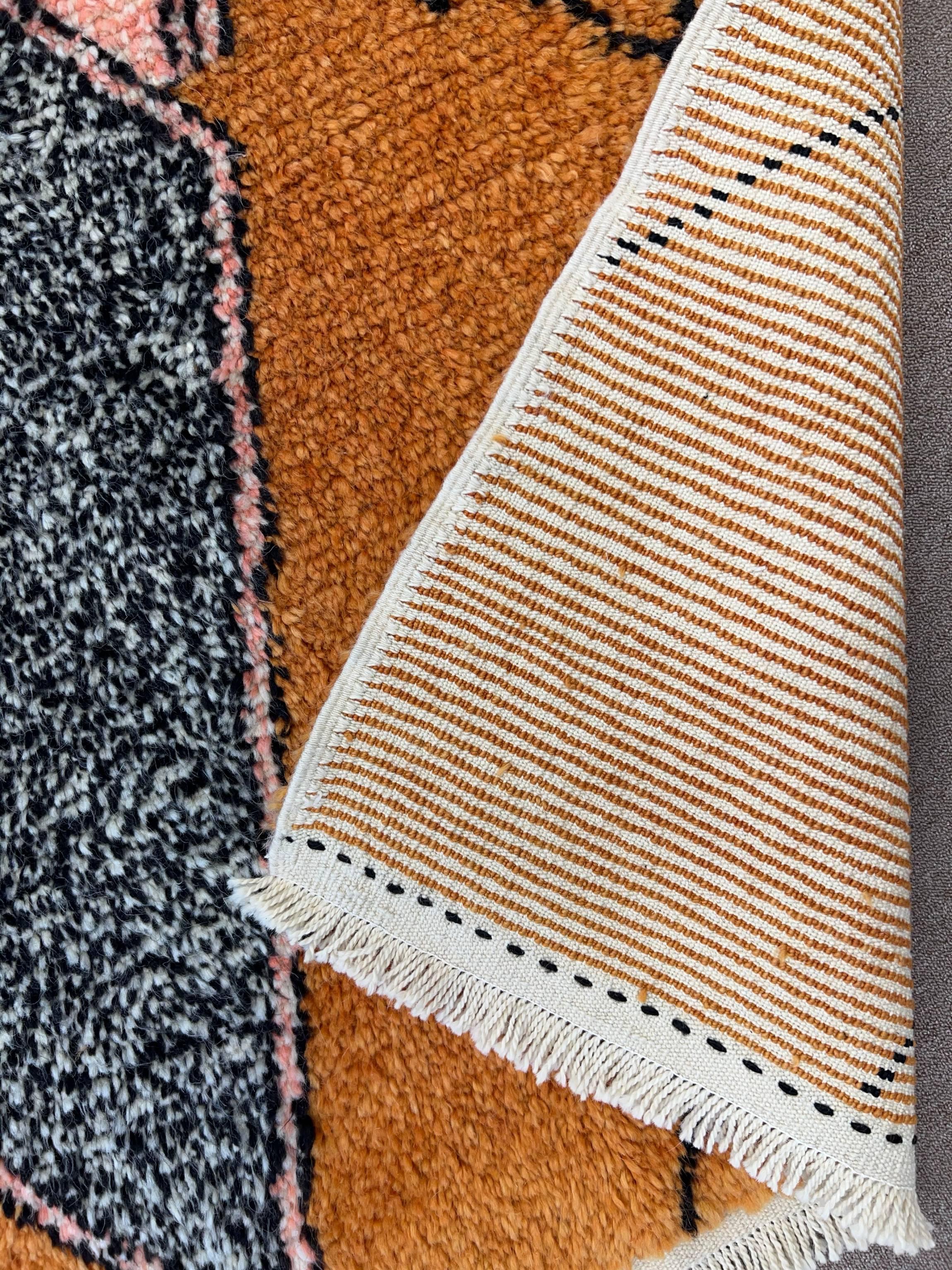 Elevate your living space with the exquisite charm of this new modern hand-knotted Moroccan berber beni ourain rug, crafted with precision and care from 100% wool. Combining the allure of Moroccan design with contemporary sensibilities, this rug is