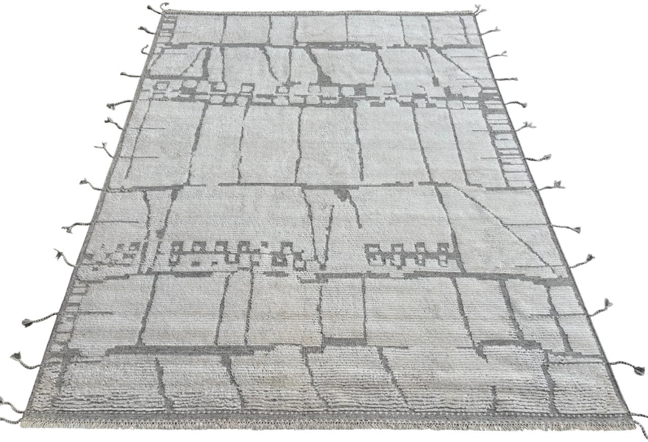 Elevate your living space with the exquisite charm of this new modern hand-knotted Moroccan berber beni ourain rug, crafted with precision and care from 100% wool. Combining the allure of Moroccan design with contemporary sensibilities, this rug is