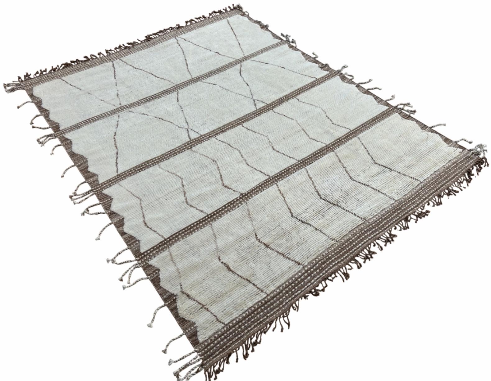 Elevate your living space with the exquisite charm of this new modern hand-knotted Moroccan Berber Beni Ourain design rug, crafted with precision and care from 100% wool. Combining the allure of Moroccan style with contemporary sensibilities, this