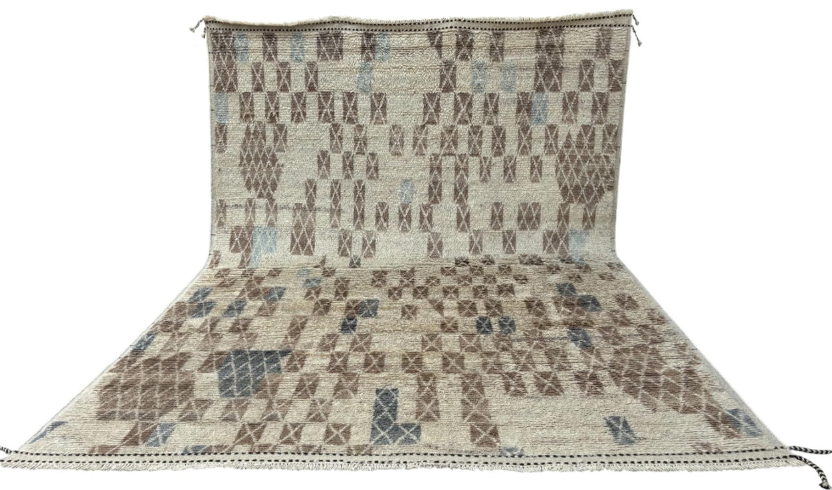 Elevate your living space with the exquisite charm of this new modern hand-knotted Moroccan Berber Beni Ourain design rug, crafted with precision and care from 100% wool. Combining the allure of Moroccan style with contemporary sensibilities, this