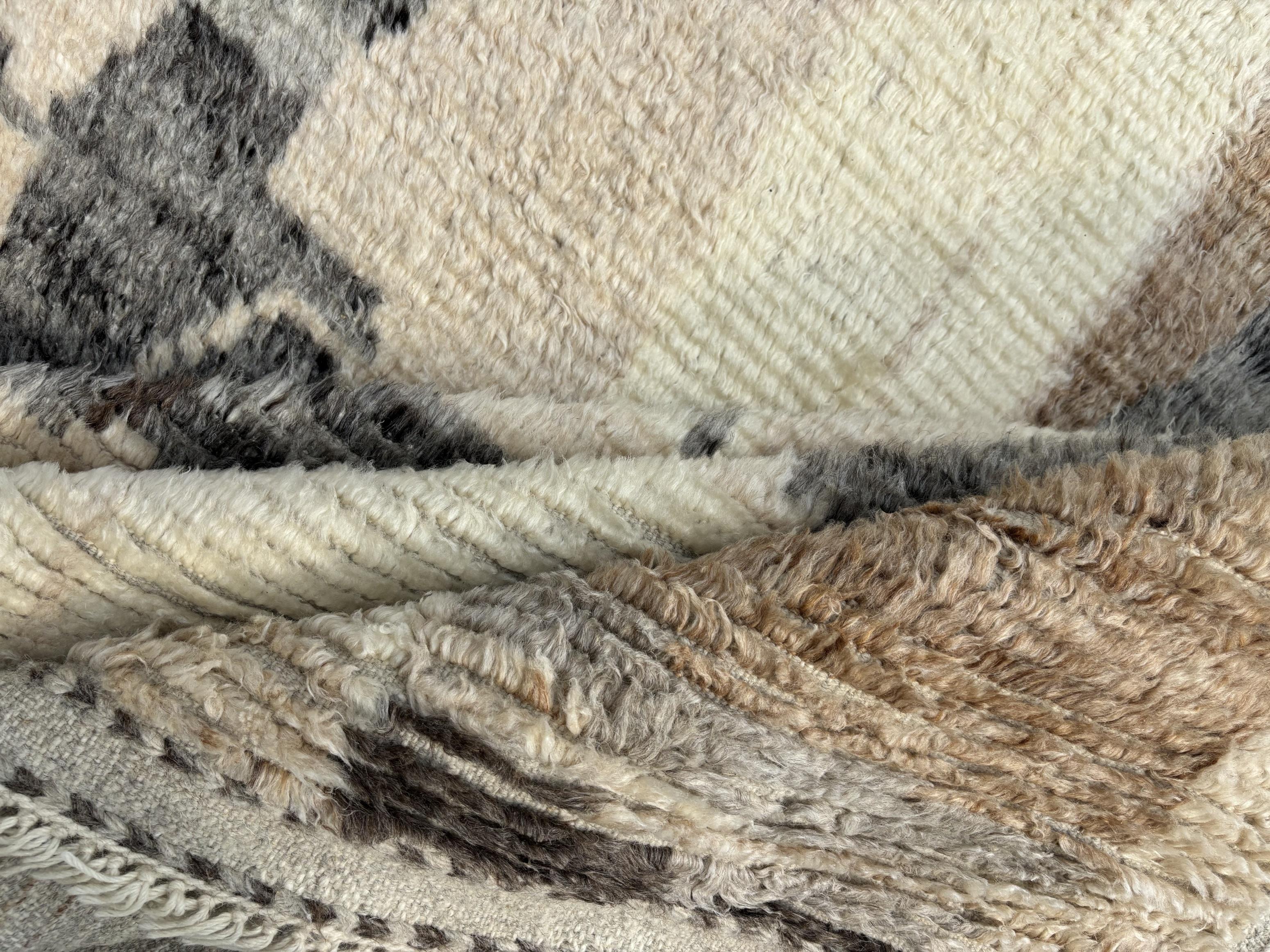 Elevate your living space with the exquisite charm of this new modern hand-knotted Moroccan berber beni ourain rug, crafted with precision and care from 100% wool. Combining the allure of Moroccan design with contemporary sensibilities, this rug is