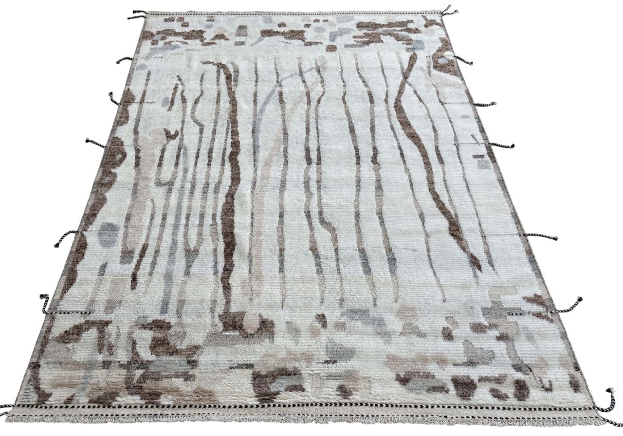Elevate your living space with the exquisite charm of this new modern hand-knotted Moroccan berber beni ourain rug, crafted with precision and care from 100% wool. Combining the allure of Moroccan design with contemporary sensibilities, this rug is