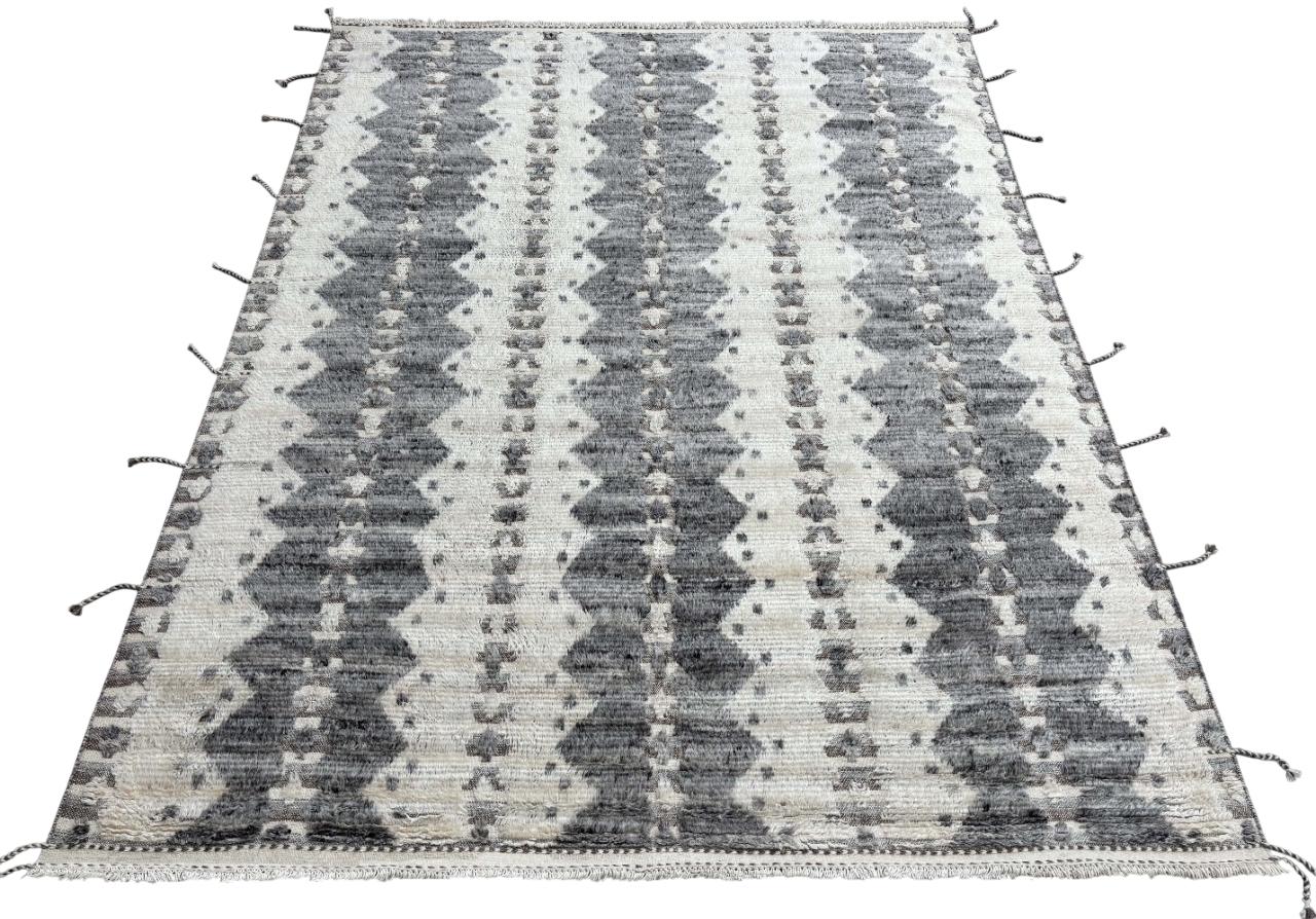 Elevate your living space with the exquisite charm of this new modern hand-knotted Moroccan berber beni ourain rug, crafted with precision and care from 100% wool. Combining the allure of Moroccan design with contemporary sensibilities, this rug is