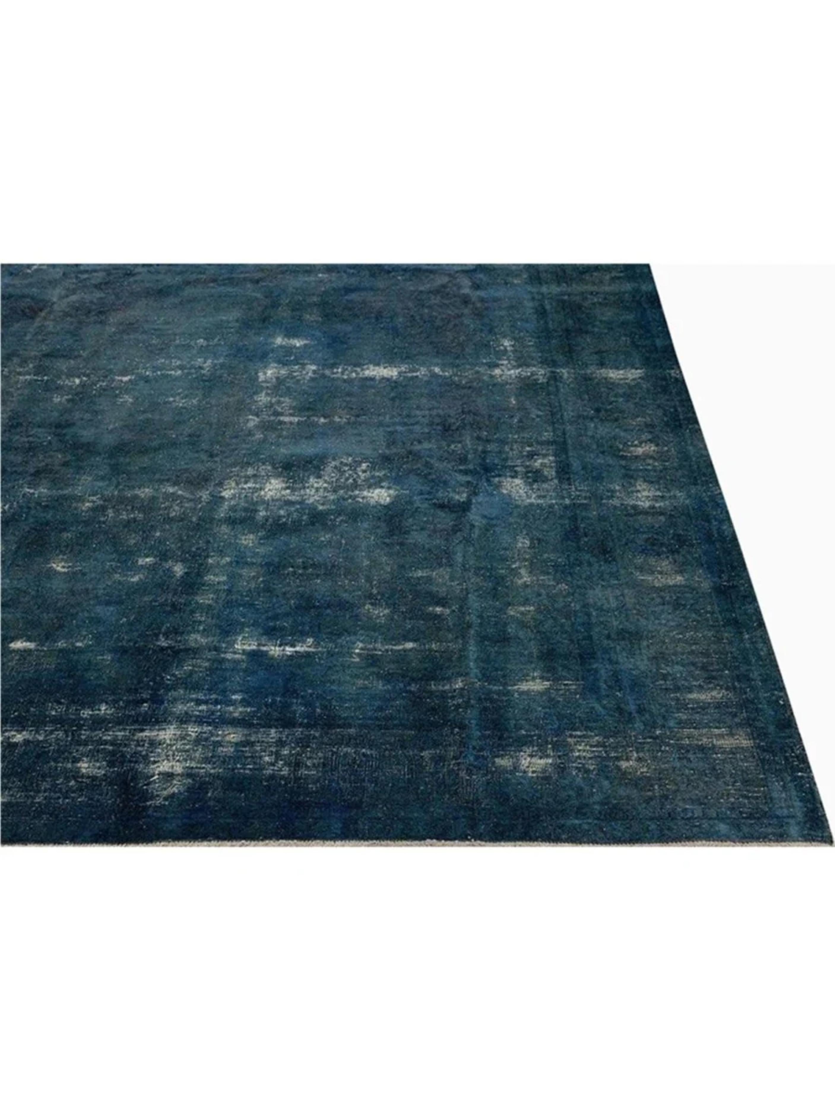 Elevate your space with the 9x12 Vintage Distressed Overdyed Area Rug, a one-of-a-kind piece that blends artistry, tradition, and timeless style. Expertly hand-knotted from premium wool, this rug reflects the skill and dedication of weavers,