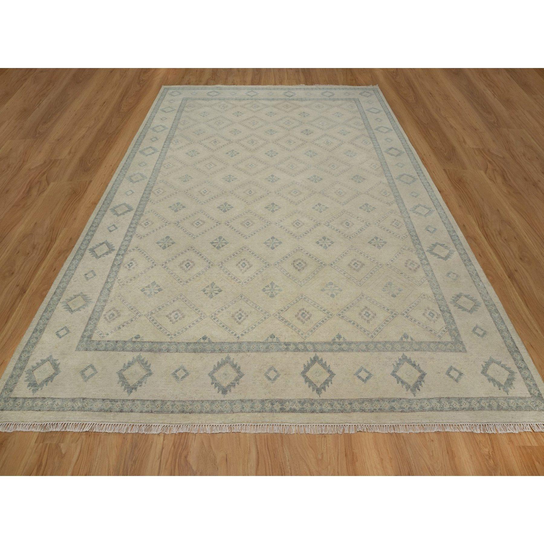 Bone White, Zero Pile, Box Design with Repetitive Triangle Tribal Motifs, Hand Knotted, 100% Wool, Oriental Rug
Primary materials: Wool
Latex: No Pile 
height: 0.25 Inches
Style: Traditional
Primary color: Ivory
Secondary colors: Gray
Pattern: