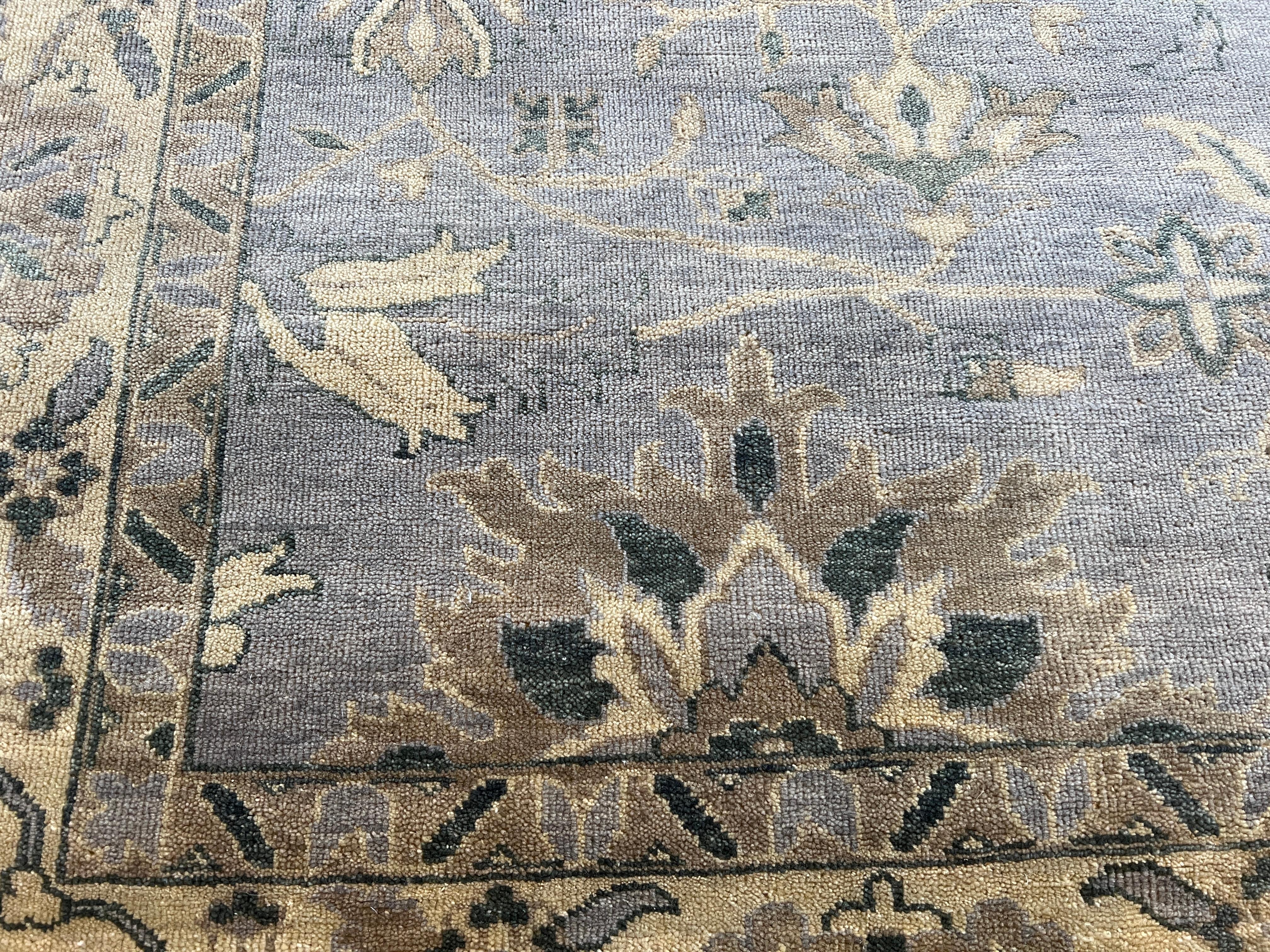 Elevate your space with our 9'x12' Persian design blue grey ivory all wool hand-knotted rug made in India. Featuring a great transitional design, this rug adds style and luxurious comfort to any room. Made with high-quality wool, it's easy to clean,