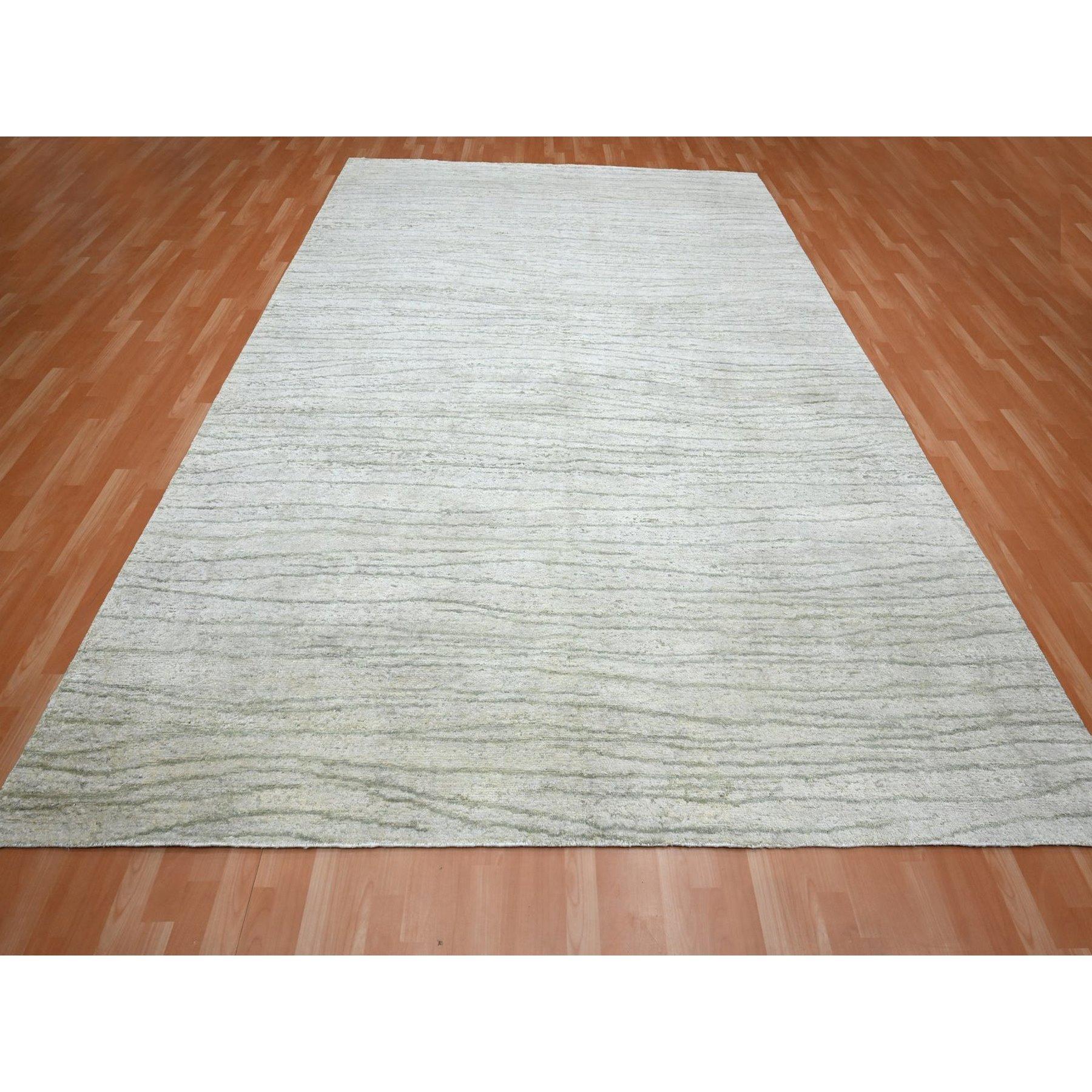 Swan White, Modern, Wavy Design, Pure Silk, Hand Knotted, Lush and Plush, Oriental Rug
Primary materials: Silk
Latex: No Pile 
height: 0.25 Inches
Style: Contemporary
Primary color: Ivory
Secondary colors: None
Pattern: Oriental
