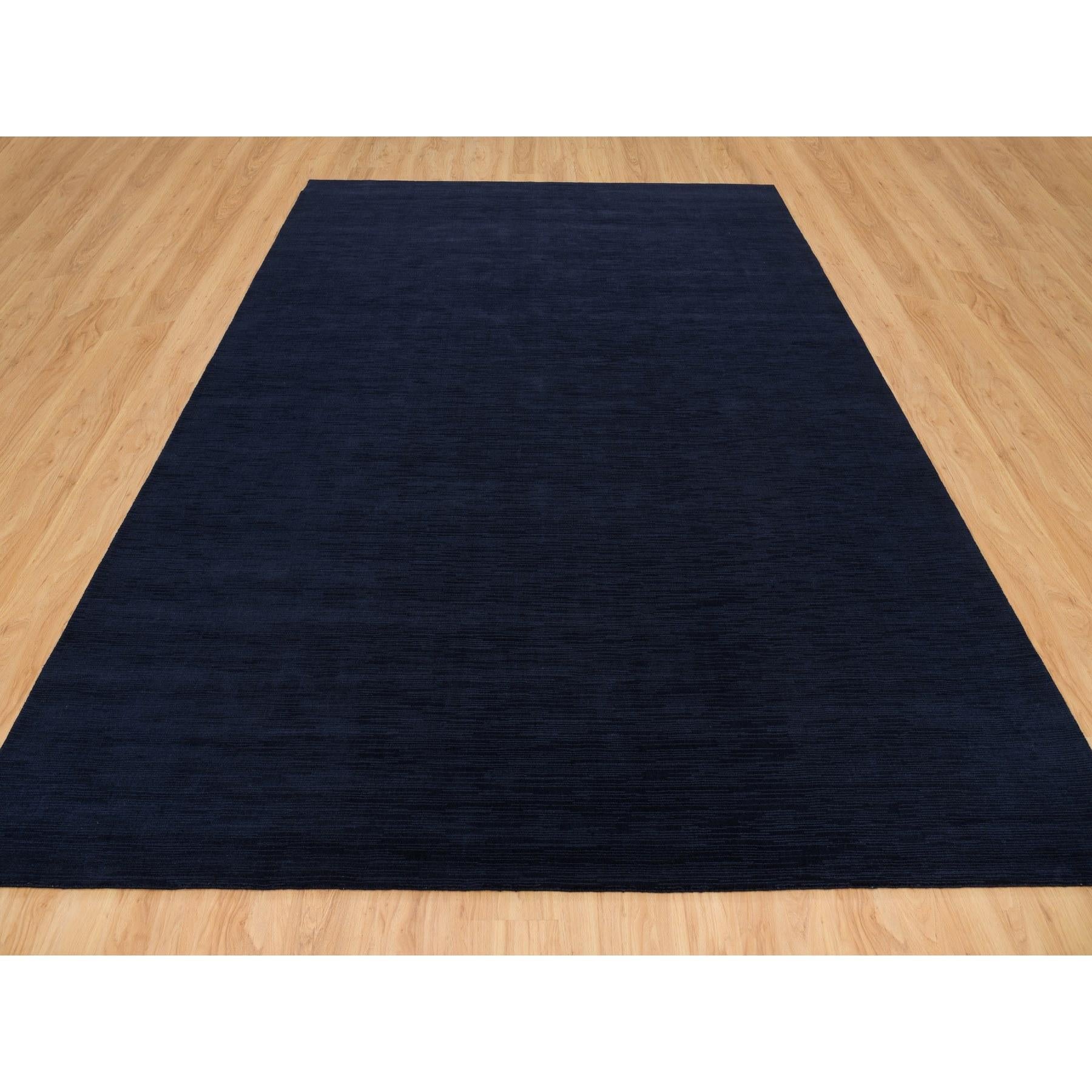 Yankees Blue, Thick and Plush Plain Loom Knotted, Wool and Plant Based Silk, Soft Pile Oriental Rug
Primary materials: Wool and Plant based Silk
Latex: No Pile 
height: 0.25 Inches
Style: Transitional
Primary color: Blue
Secondary colors: