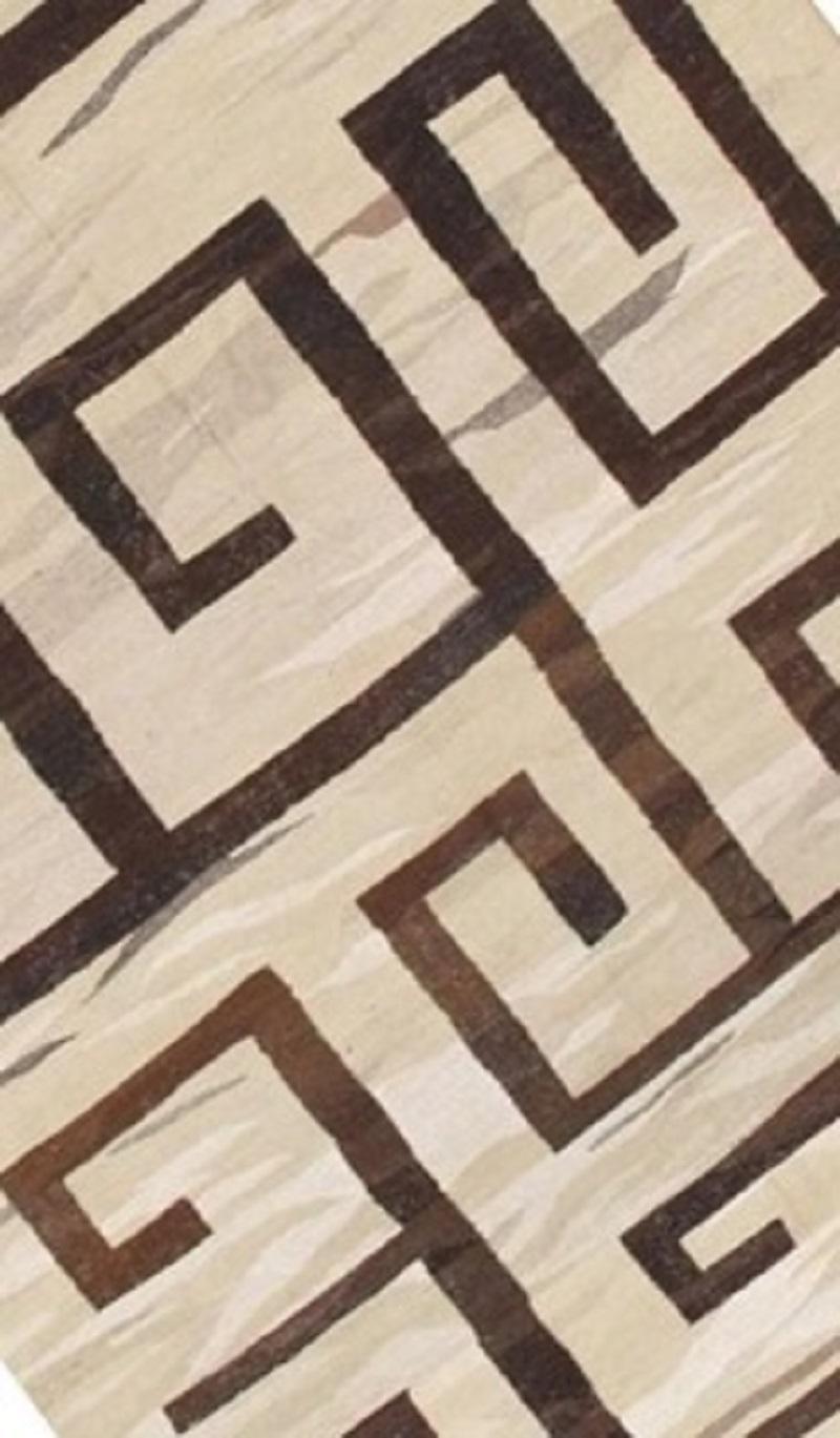 A flat-weave Kilim rug from Turkey made of natural undyed sheep wool in brown and cream colors. Sturdy and ideal for both residential and commercial interiors. Measures: 9 x 16 Ft

An identical rug can be re-produced in any size and color