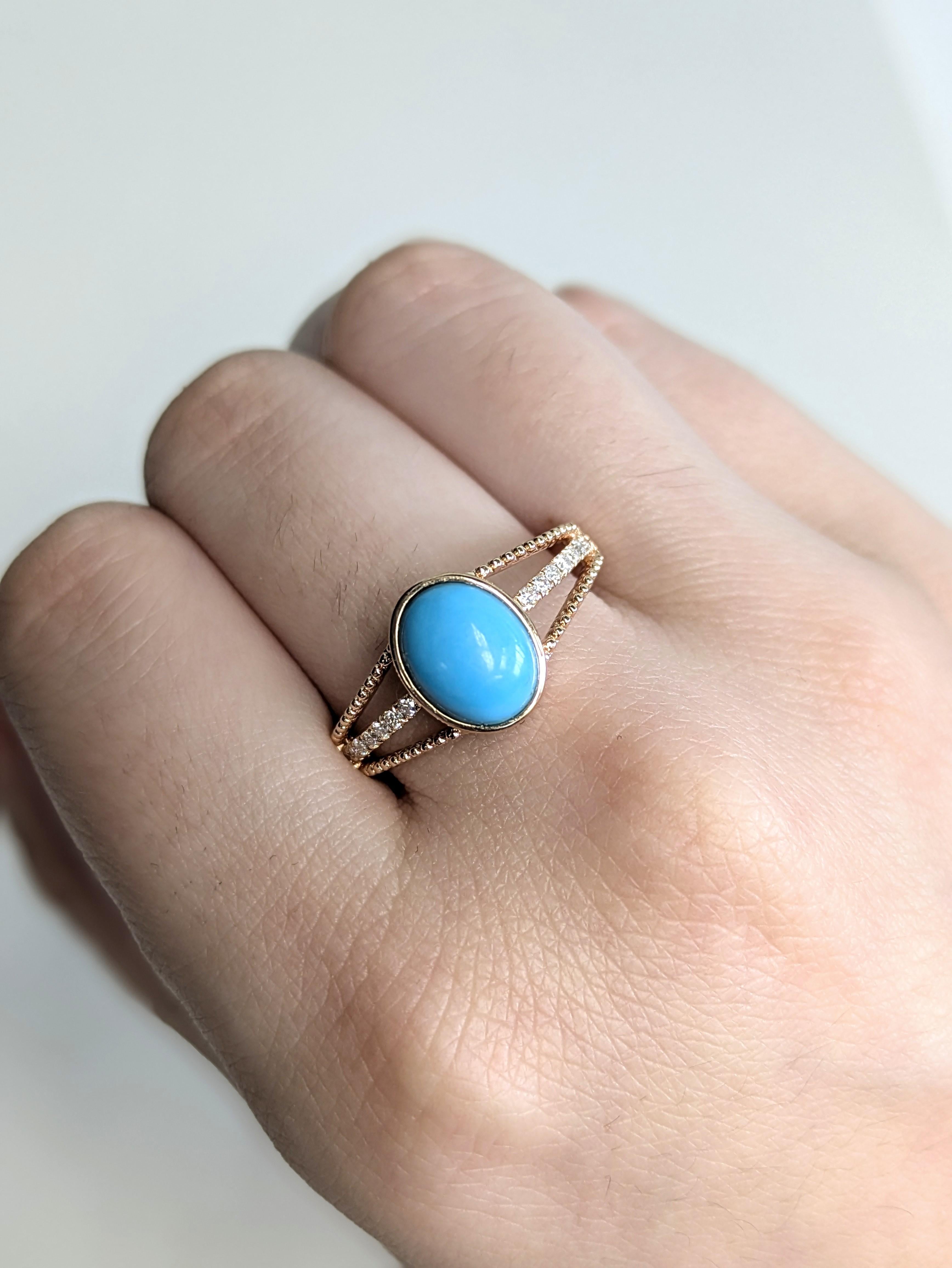 A dreamy 1.8 carat Arizona Sleeping Beauty turquoise rests in a smooth bezel setting, radiating sky-blue charm. The oval gem is gracefully set on a solid 14K rose gold band with a three-layer split shank, paved with shimmering earth-mined diamonds