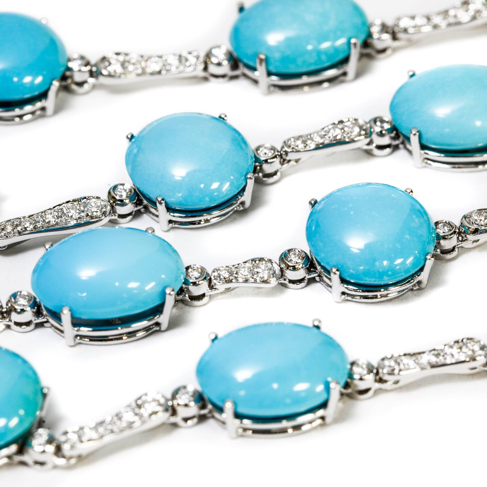 This A & Furst drop necklace features 98.50 ct. round and oval cabochon cut turquoise stones as well as 1.63 ct. pave-set round diamonds in 18k white gold. It is in perfect condition and looks new. The length is adjustable (see photos).

We have the