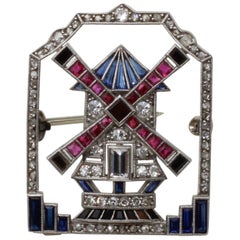 A 0.85 Carat Platinum Art Deco Windmill Diamond, Ruby, Onyx
Sapphire Brooch A 0.85 Carat Platinum Art Deco Windmill Diamond, Ruby, Onyx
Sapphire Brooch