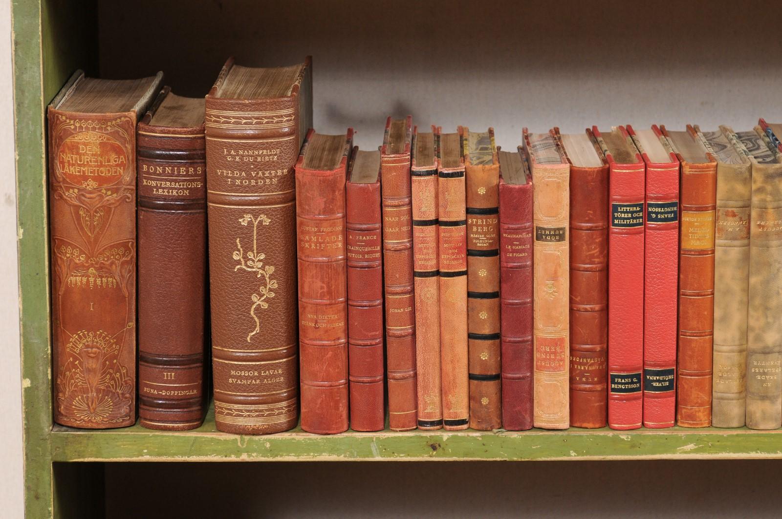 20th Century 10 Ft. Run of 100 Swedish Antique Leather-Bound Books, in Varying Warm Tones