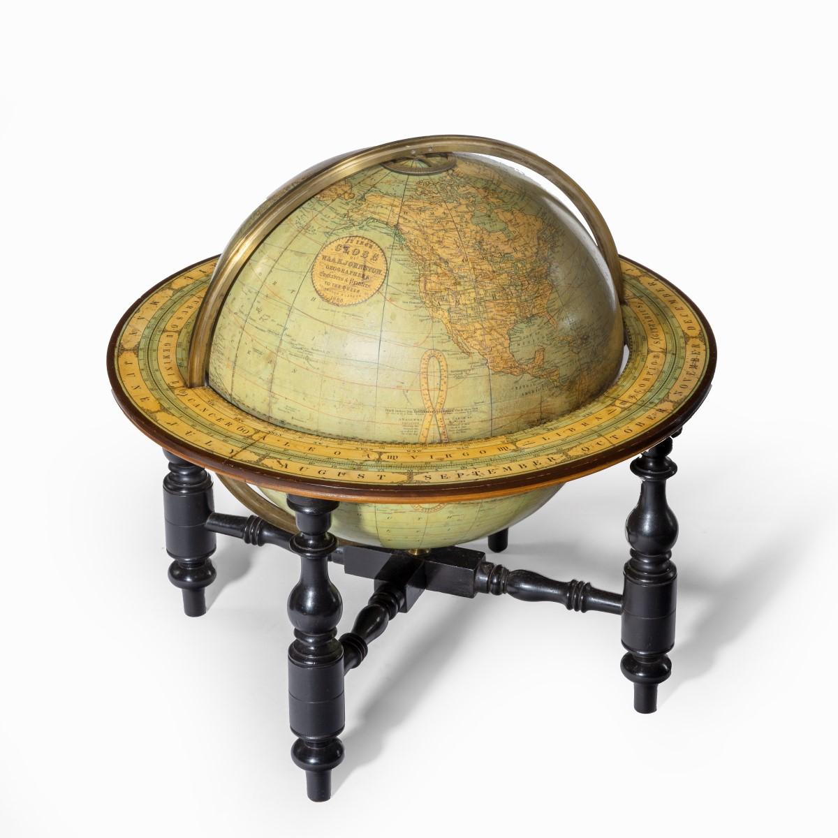 A 12 inch globe by W & AK Johnston, dated 1888, the terrestrial globe set in an ebonized stand with four turned legs and cross stretchers, the cartouche reading ‘12inch Globe by W. & A.K. Johnston Geographers and Printers to the Queen, Edinburgh and