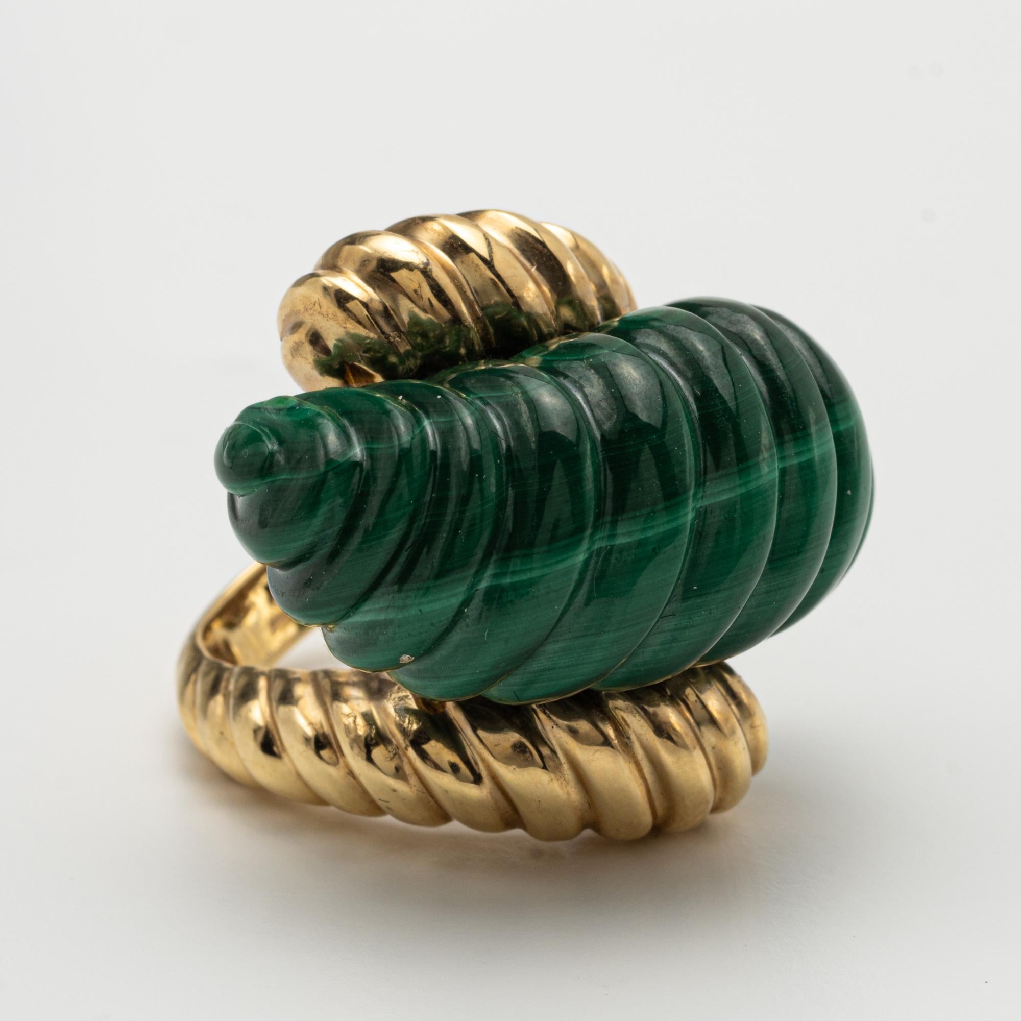 A 14k yellow gold and malachite abstract ring
size 5 3/4