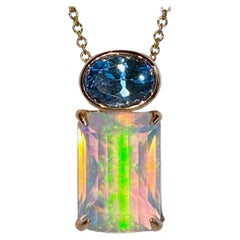 A 14kt Rose Gold Pendant set with Topaz and Opal