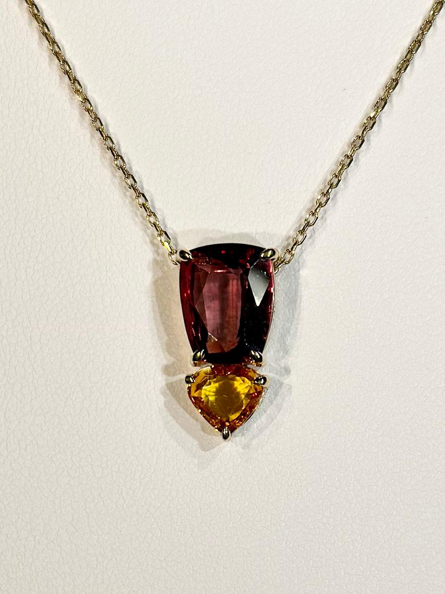 Modern A 14kt Yellow Gold Pendant with Sapphires For Sale
