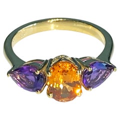 Ring aus 14-karätigem Gelbgold mit Mandarin-Granat und Amethyst