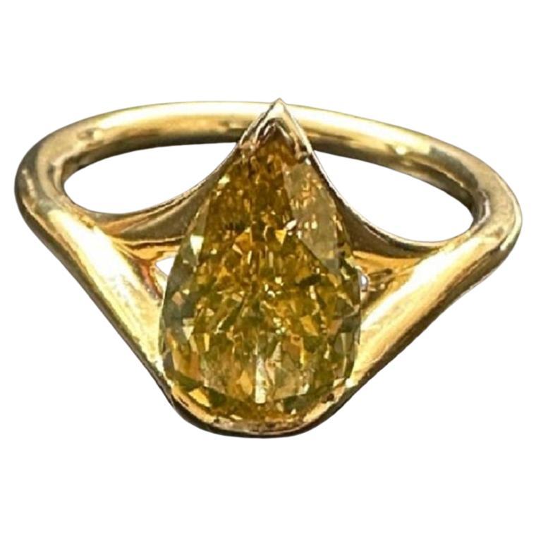 A 1.59 ct Pear Shape Fancy Deep Brown Yellow Diamond Ring For Sale