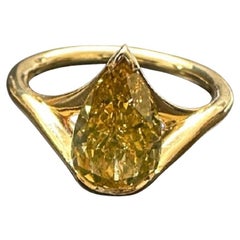 A 1.59 ct Pear Shape Fancy Deep Brown Yellow Diamond Ring