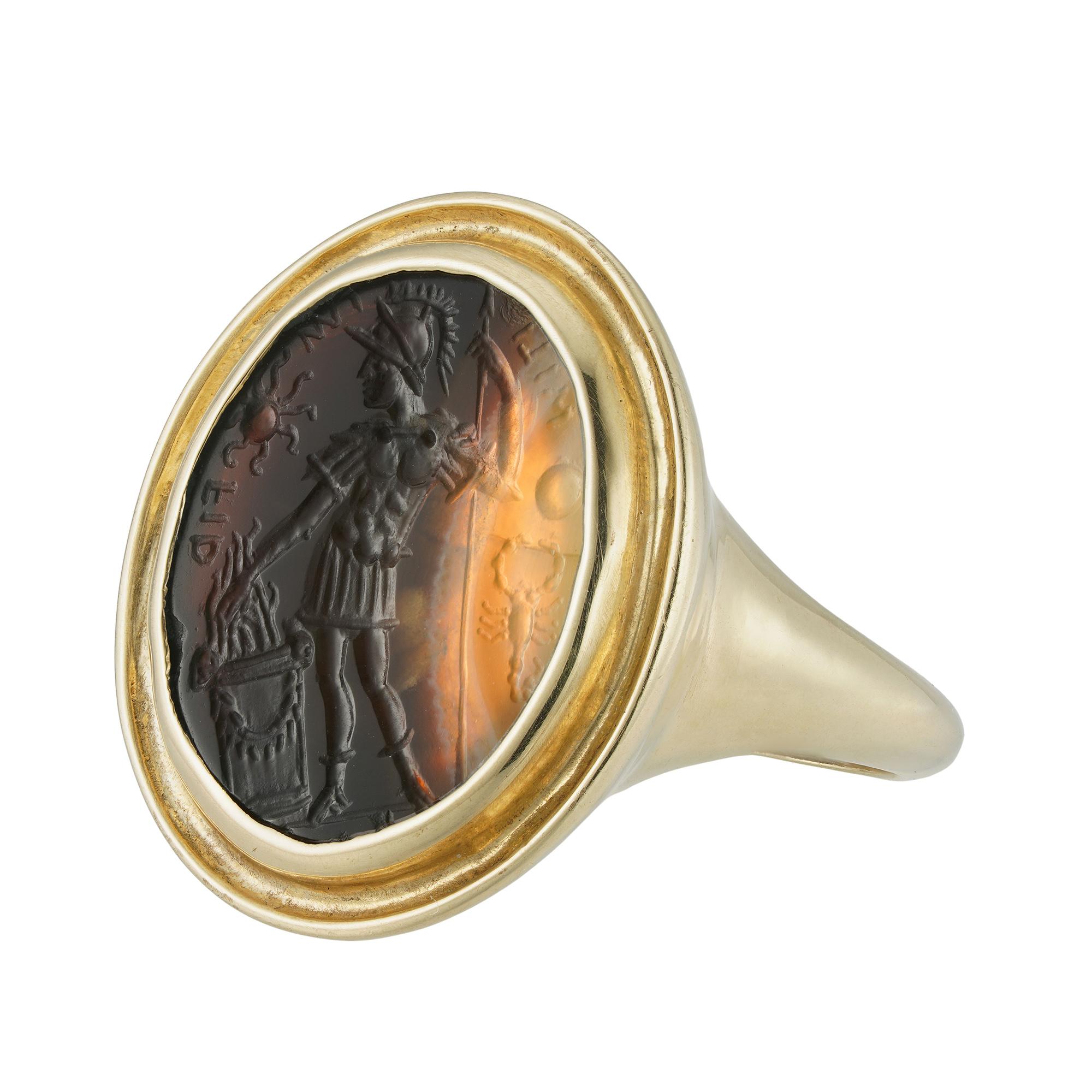 A 16th century Italian agate intaglio depicting Gaius Mucius Scaevola, the oval shaped agate measuring approximately 1.9 x 1.6cm, depicting Scaevola on a standing position with his right hand into a fire, inscribed MILI IM FID and decorated with the