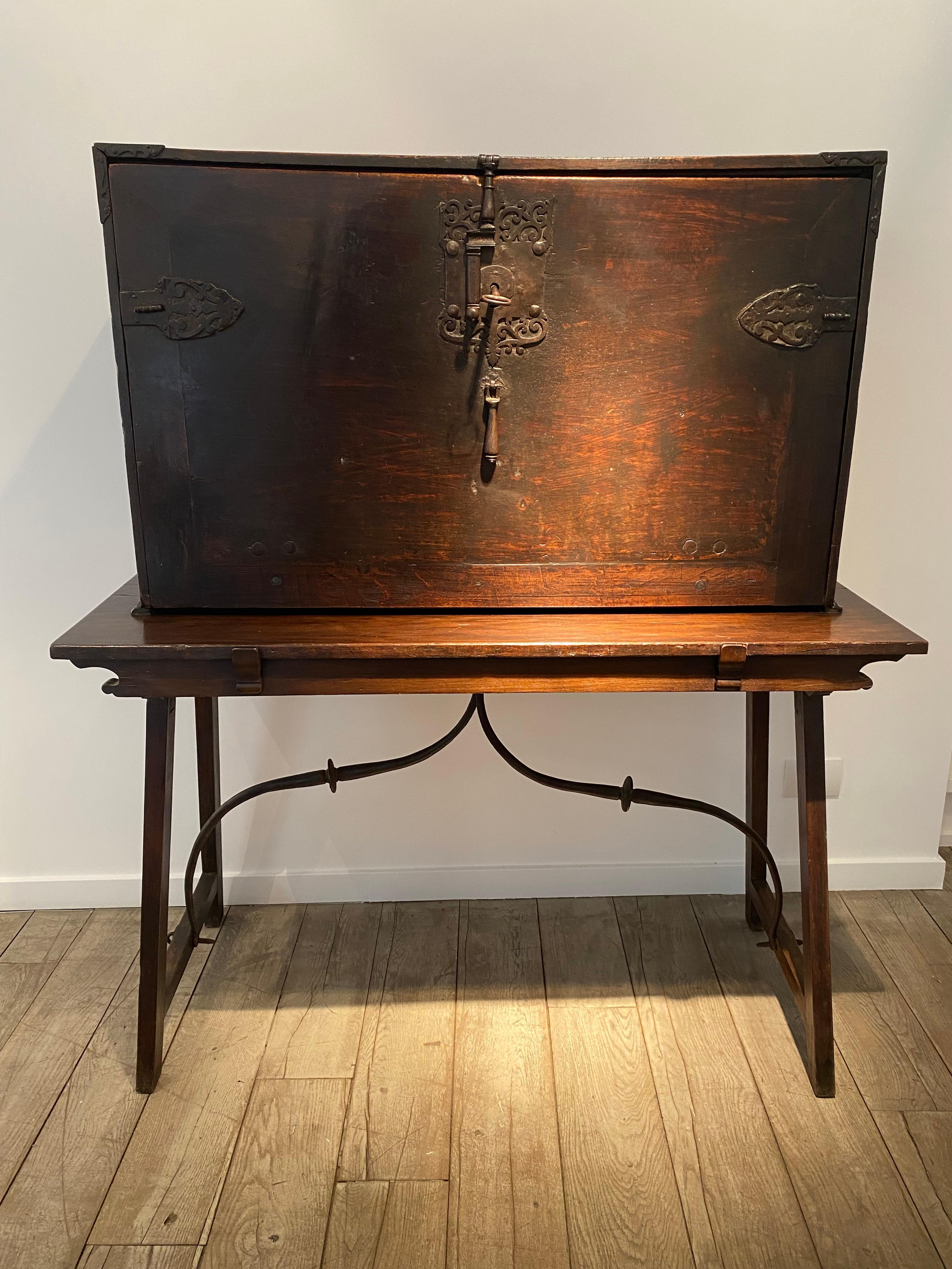 An antique Spanish Walnut Bargueno fall front desk,
this 2 piece cabinet has the original hand wrought Iron handles on the sides and the original lock on the front; molded and carved Walnut small drawers and compartments and cupboards.
Superb