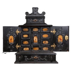 Antique A 17th century Augsburg ebonized cabinet with painted pietra paesina panels
