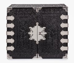 A 17th century Dutch-colonial ebony two-door VOC cabinet with silver mounts