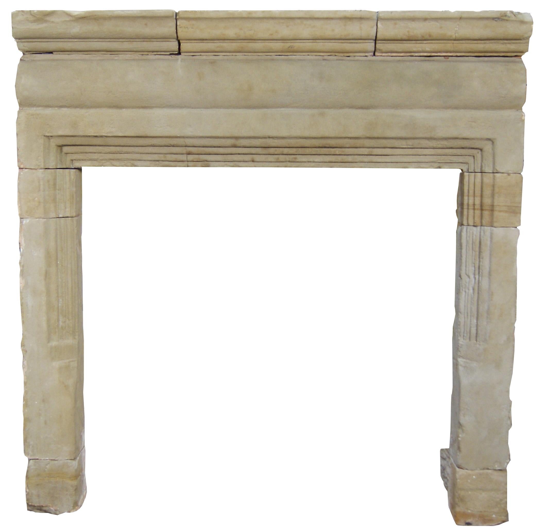 A rare 17th century (Charles II) English stone chimneypiece. The shaped jambs supporting a barrel frieze and moulded shelf. c 1660.

Please note that this fireplace was partially built into a wall. However, can be reduced in depth if