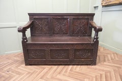 A 17th Century High Back Oak Box Settle   The Settle has 3 carved back panels