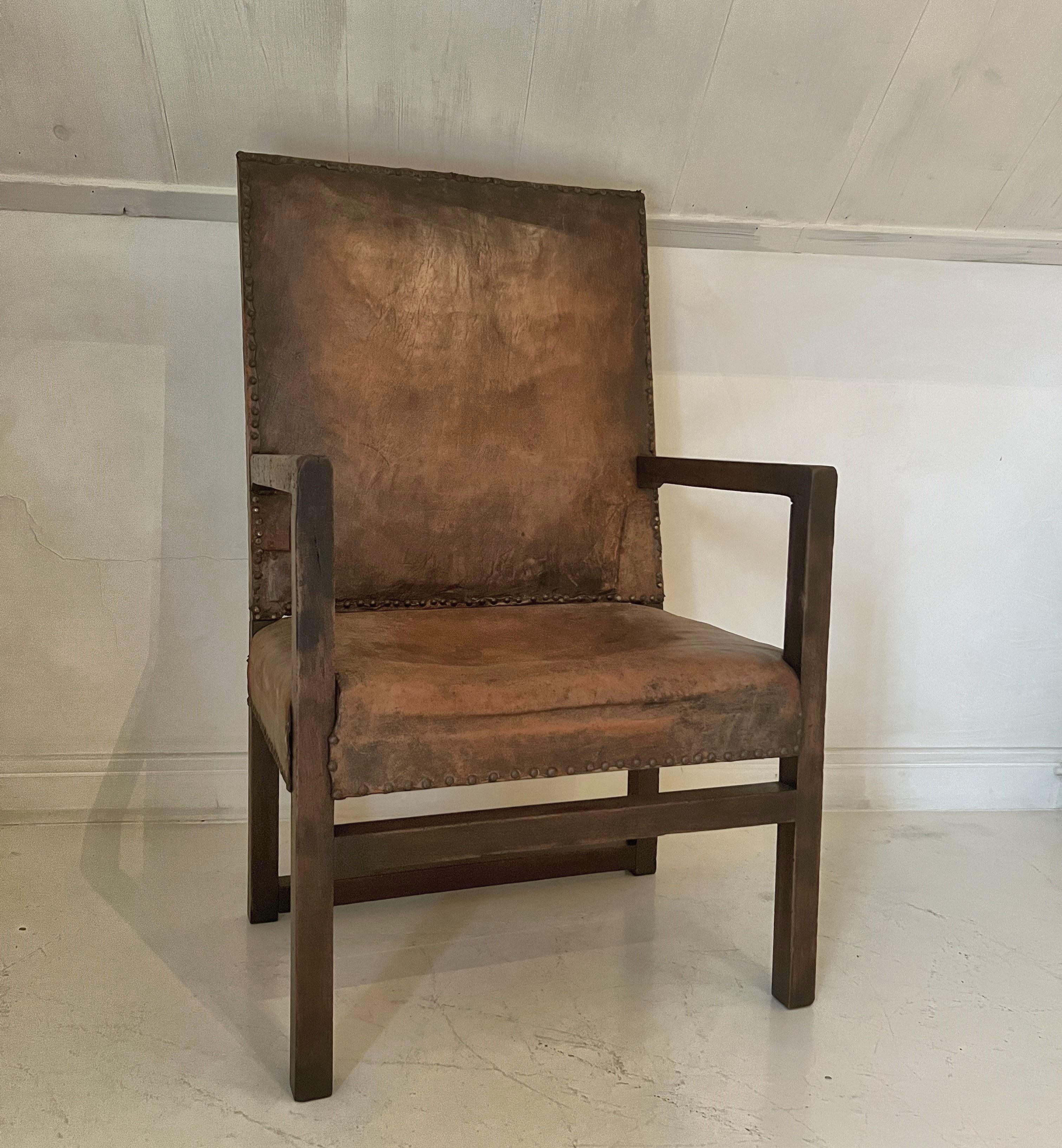 A 17th century armchair with beautifully patined walnut and leather. The design almost timeless with simple yet perfectly proportioned straight lines. Sturdy and very comfortable. All together a piece that could fit in any setting and ads some