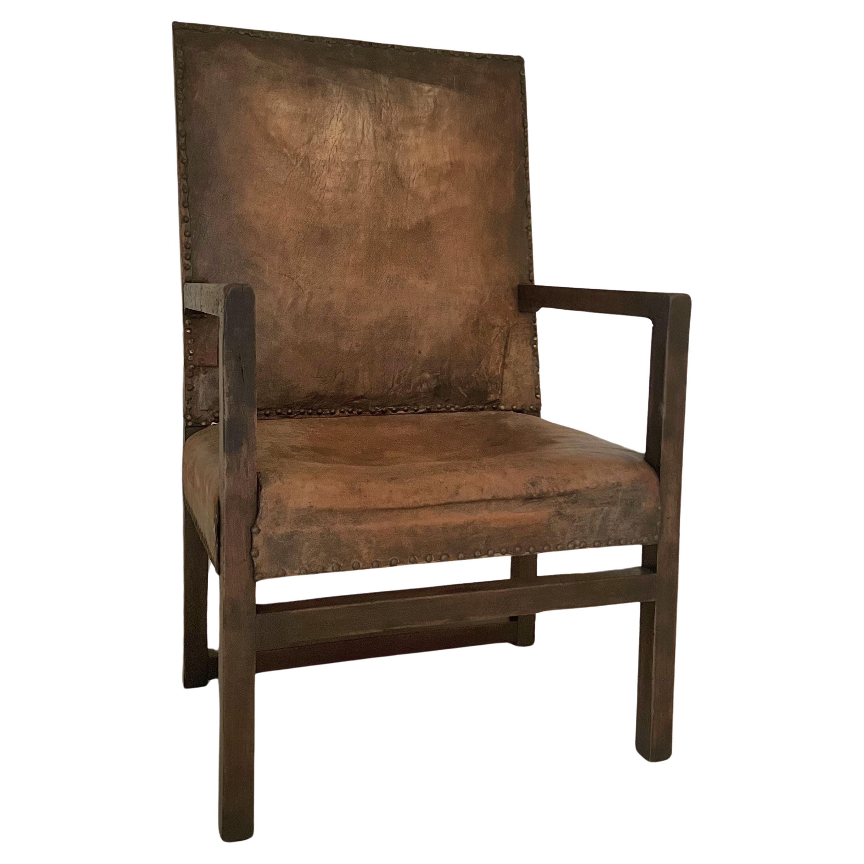 A 17th century walnut and leather armchair modernist feel For Sale