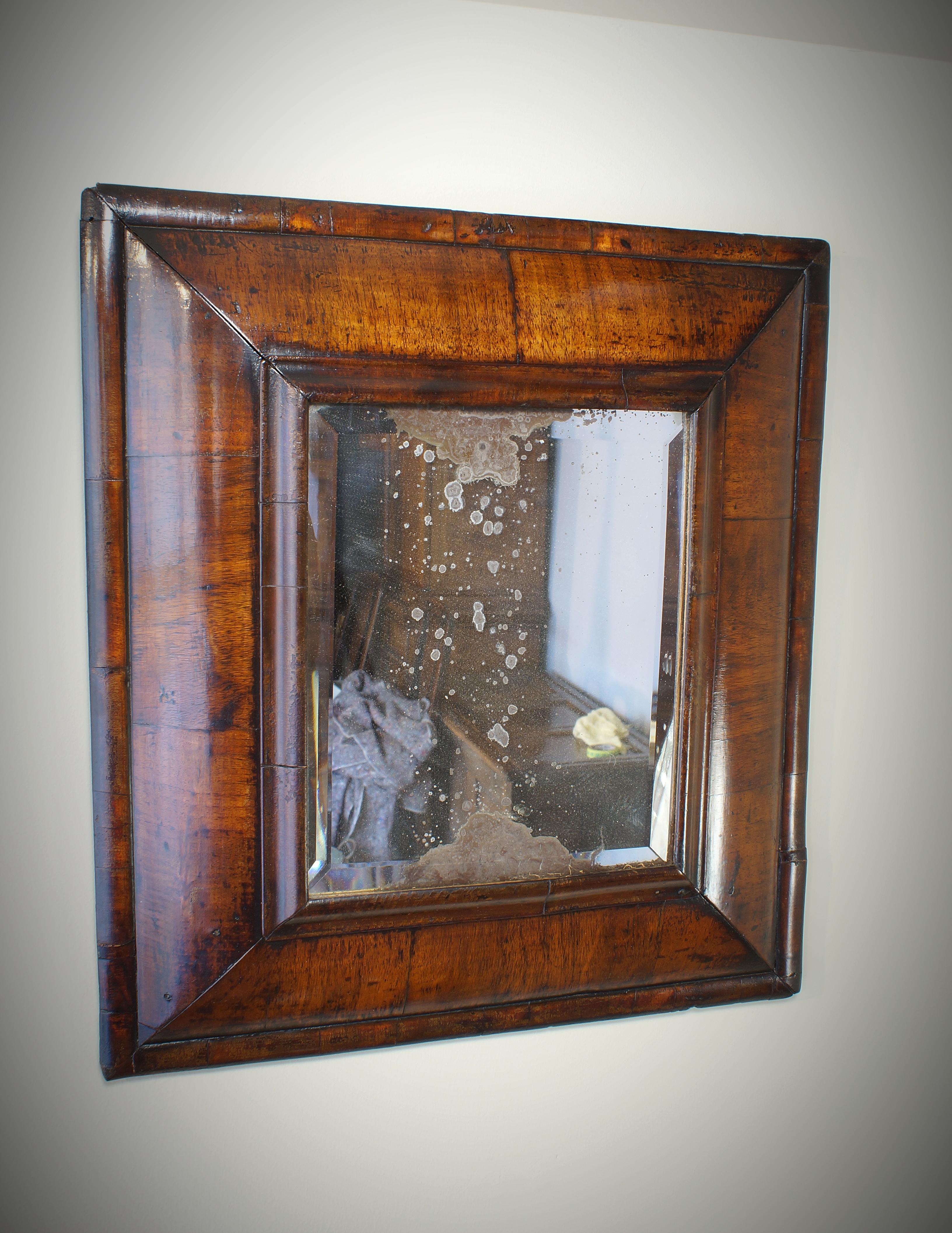 Molded A 17th Century William And Mary Walnut Cushion Moulded Mirror.