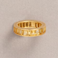 18 Carat Gold Eternity Ring with Baguette Cut Yellow Sapphires by Hemmerle