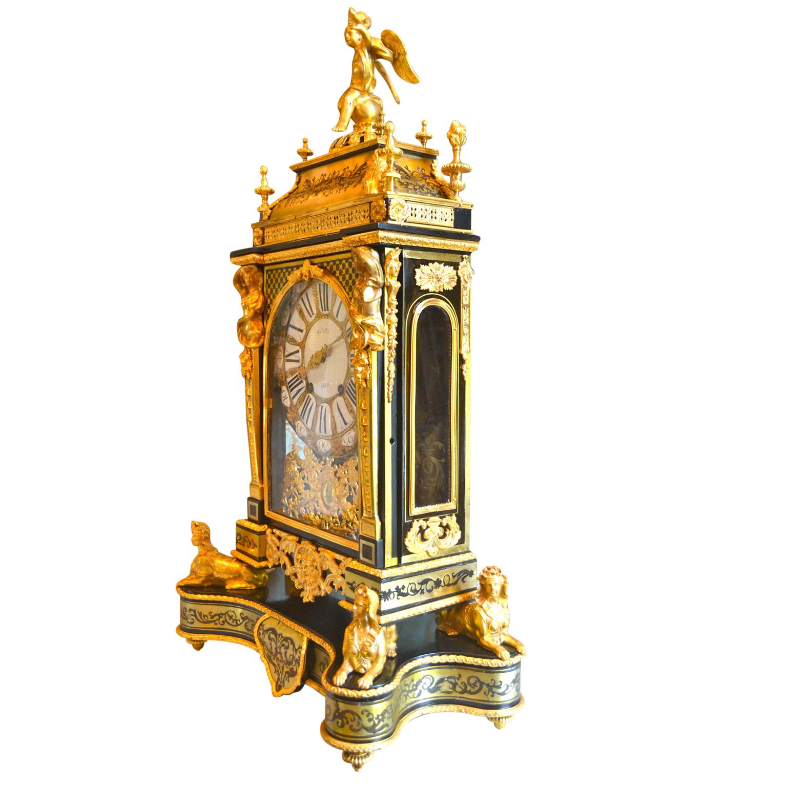 A magnificent, completely restored Louis XV bracket clock by Michel   a  Dijon, signed on the dial and the time/strike movement. A winged putto in partial drape seated upon the removable architectural top, with two bells concealed beneath. The