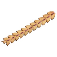 Gliederarmband aus 18 Karat Gelbgold und Rubin