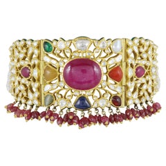 A 18K gold Indian wedding Navratna choker with nine gemstones and diamond polkis
