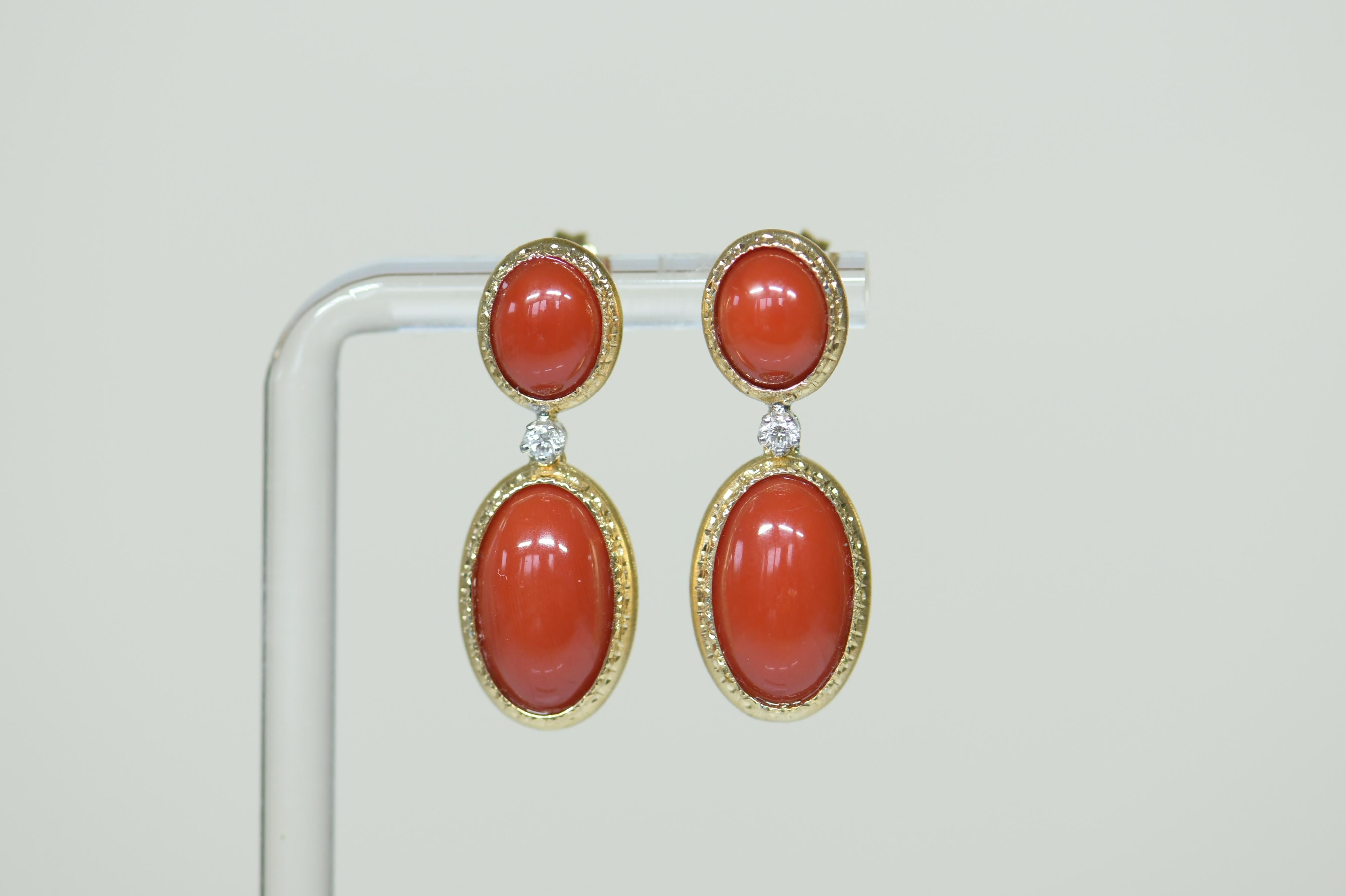 Exquisite pair of 18k yellow gold, diamond and natural un-treated oxblood red coral earrings. These are for pierced ears 3cm long x 1cm wide. The earrings consist of approx. 0.3ct of sparkly diamonds. Coral has beautiful deep red coral, there are