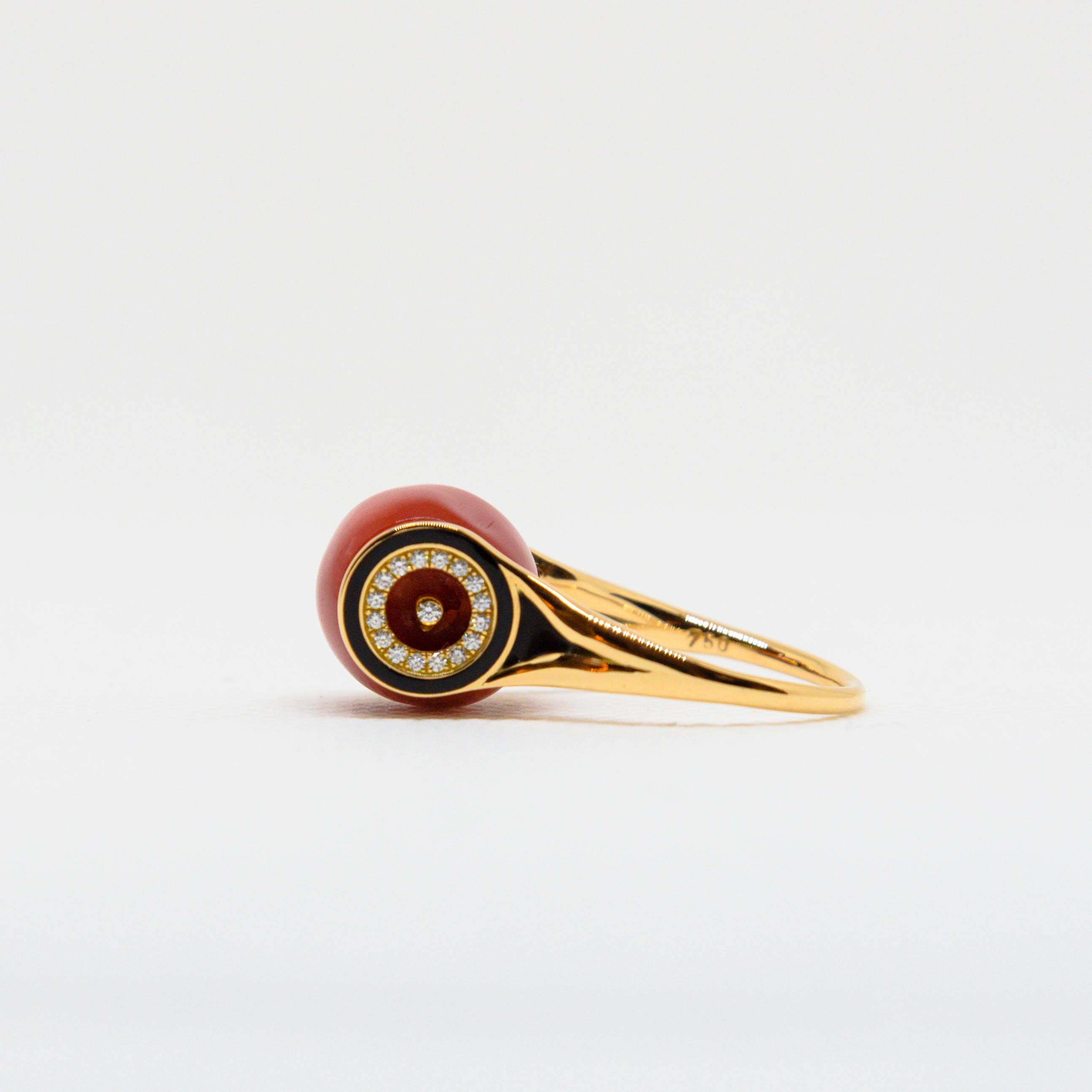 MINOS
A 18K Rose Gold, Red Coral and Diamonds Ring by Frederique Berman.
Bearing the name of legendary Cretan King, Minos is a sensuous red coral barrel set with diamonds (0,158 cts), in a rose gold mount shaped as a target, in an Art-Deco-inspired