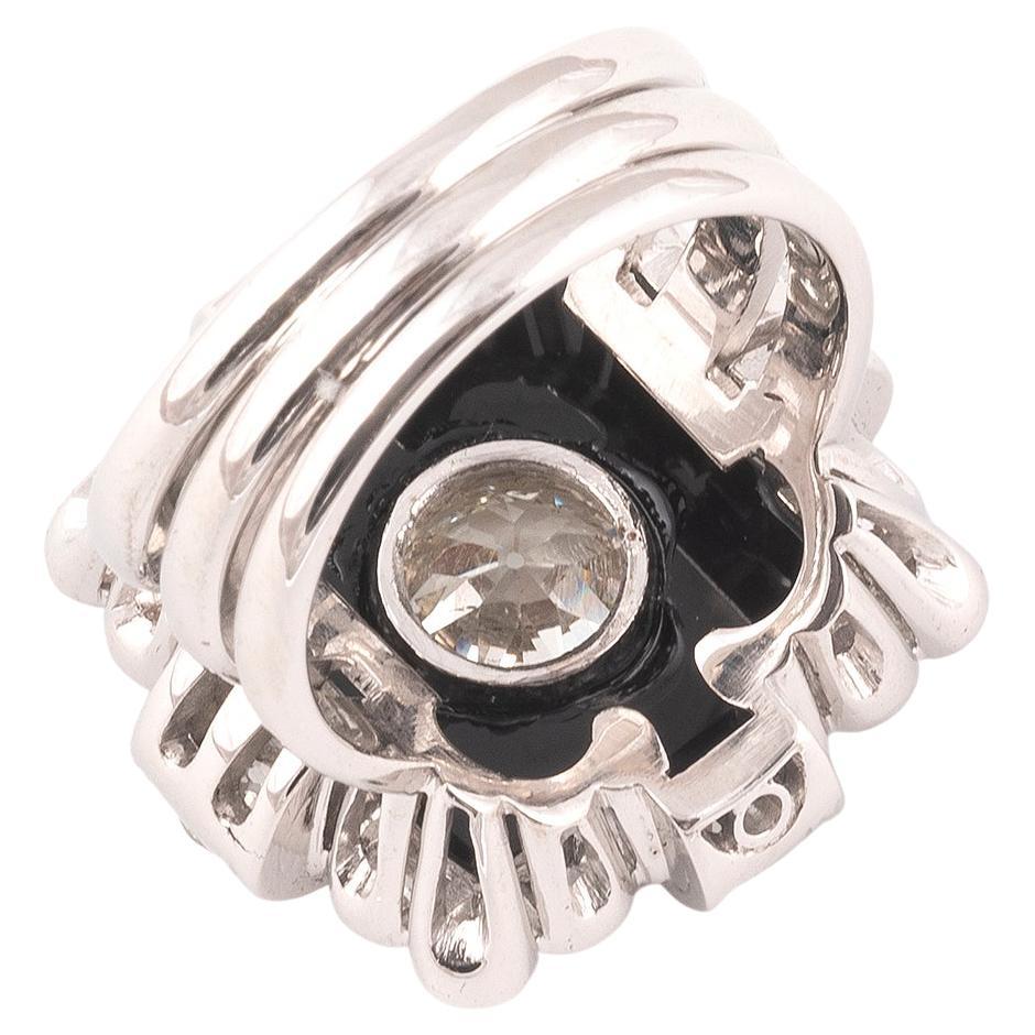 Featuring a square-shaped onyx centering a round diamond weighing approximately 1.85 carats, size 8 3/4