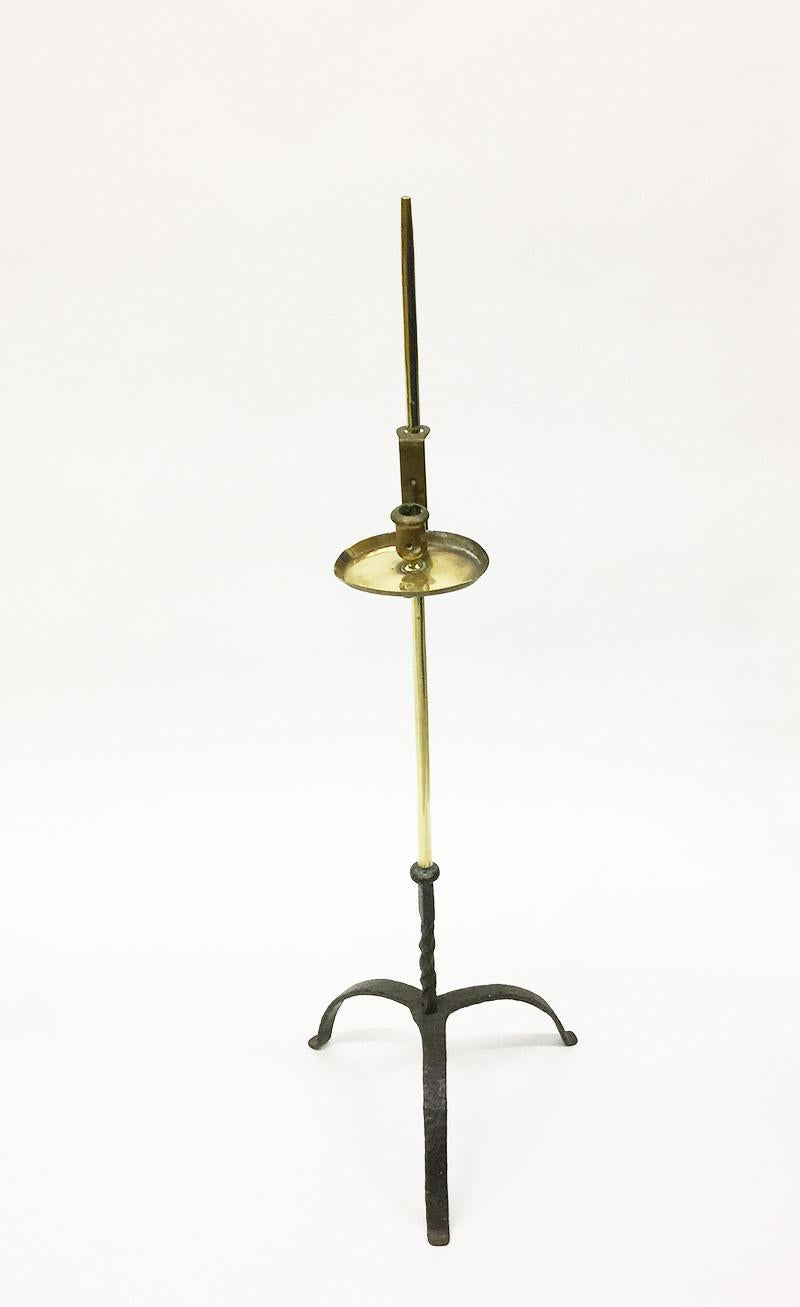 A 18th century Dutch floor brass candleholder

A 18th century Dutch floor brass candleholder on tripod base of wrought iron
The candleholder is adjustable

The measurements are:
100 cm high
32 cm wide
The dept is 32 cm

The weight is