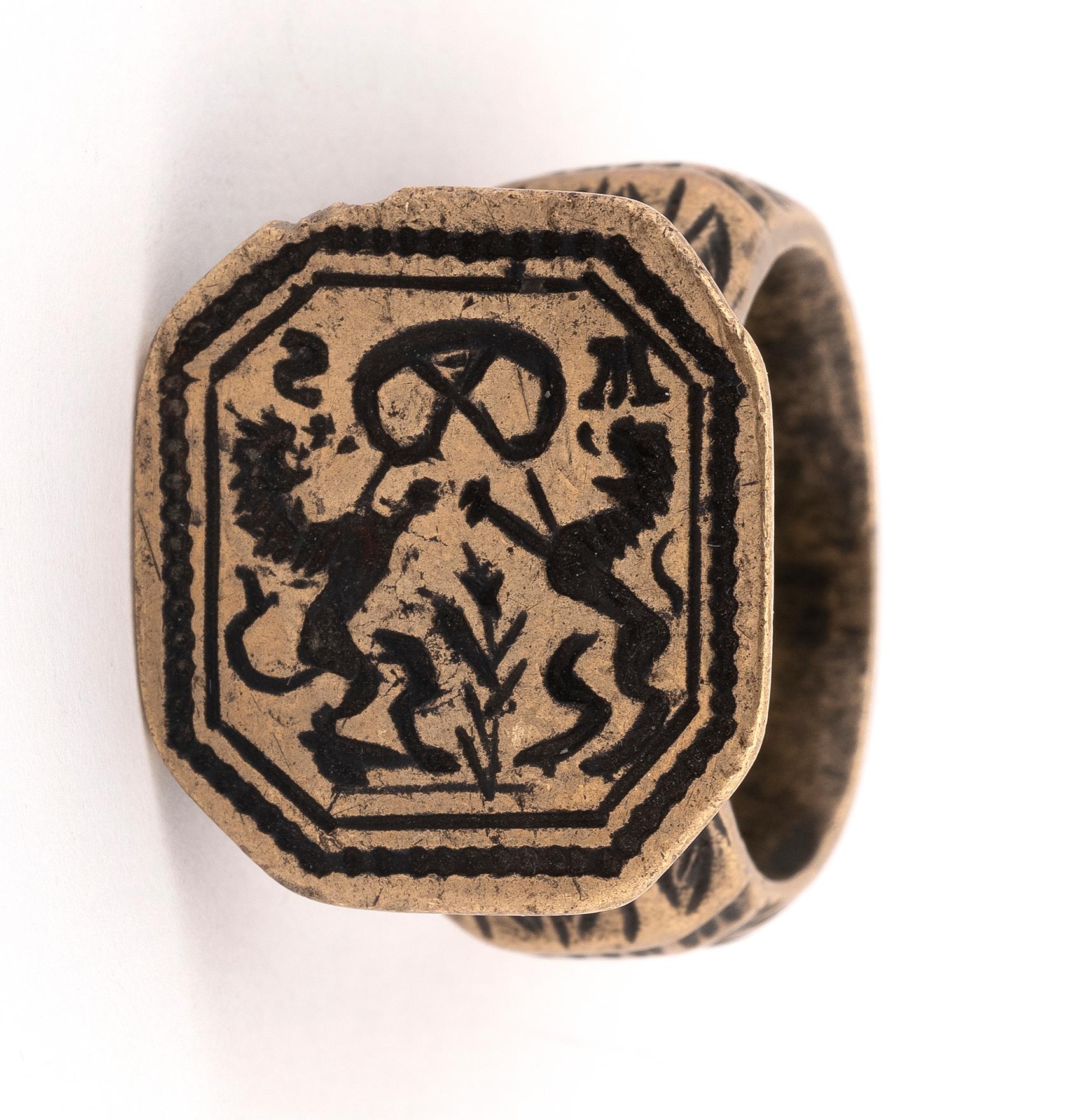 The bronze ring with an octagonal plaque carved with merchant's symbols.
Dated 1773
Ring size 9