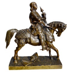 A 19 Century Bronze Statue of St Joan of Arc in full body armour on horseback