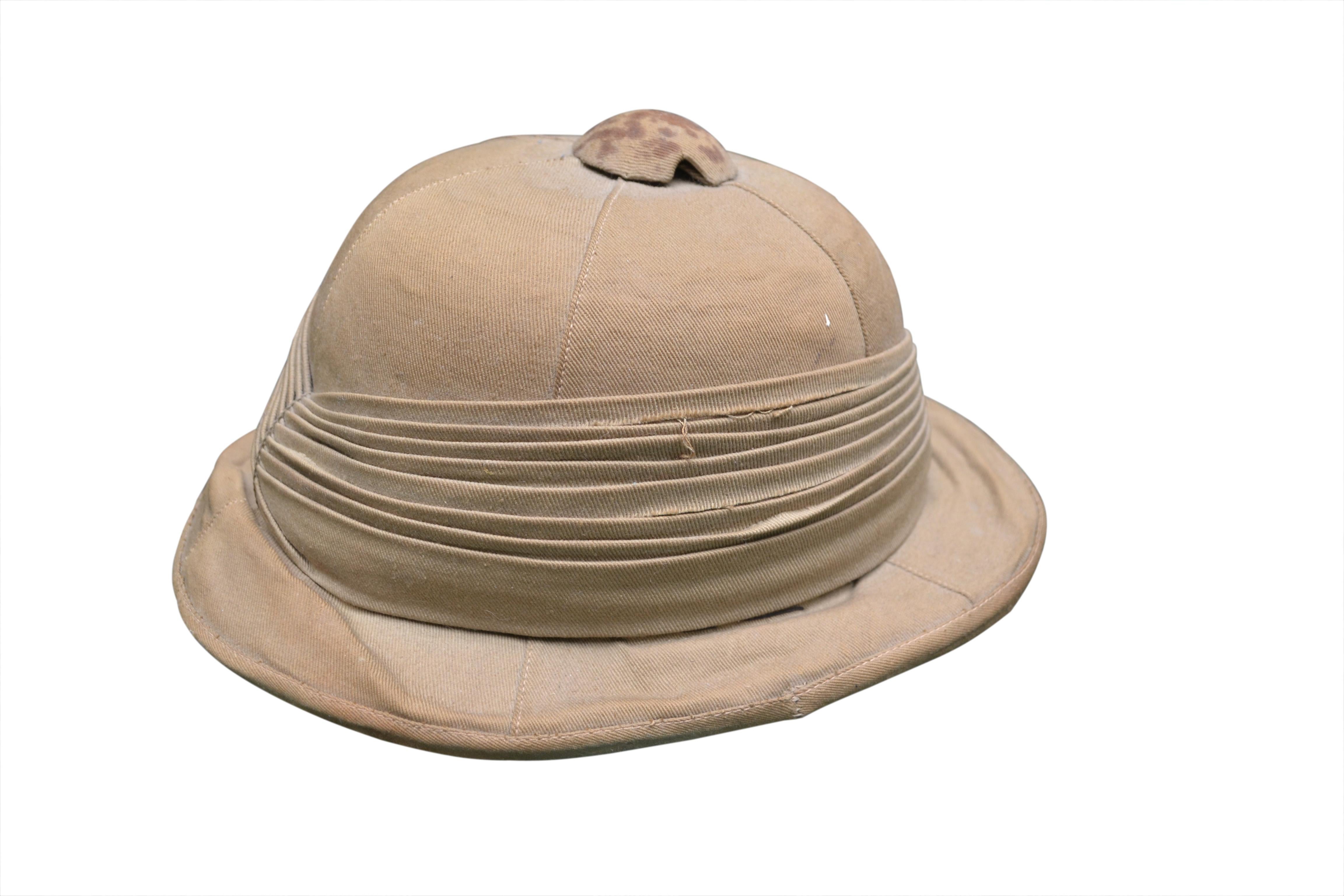 A classic English 19th century Colonial officer's hat made by Star Millinary, Hatters 
 & Milliners of 0.58 Municipal Market in CalCutta India. Mkaers label on the inside of the hat. It will fit a head that is 7.5