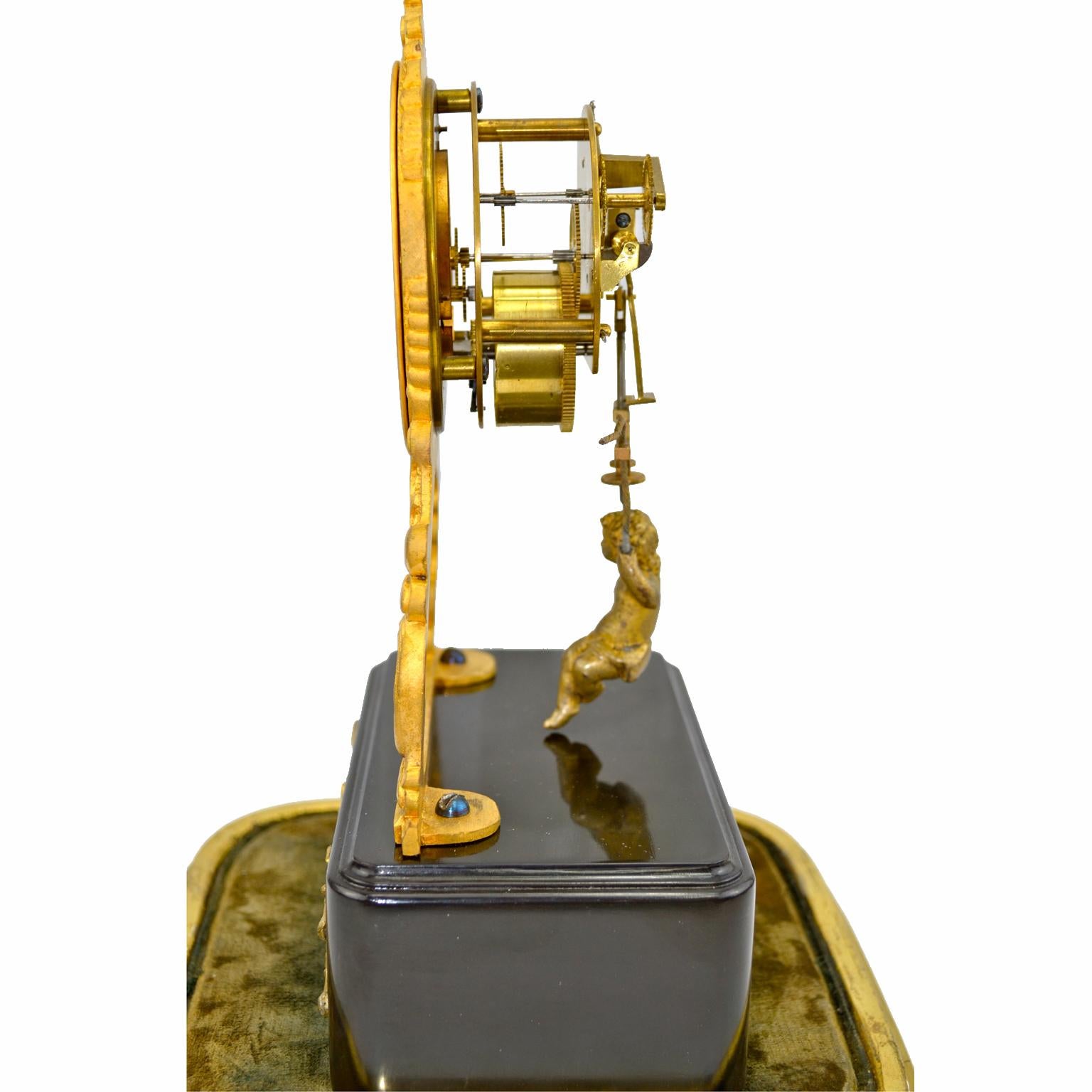 Napoleon III 19th Century Glass Domed Gilt Bronze French Mystery Clock with a Swinging Putto