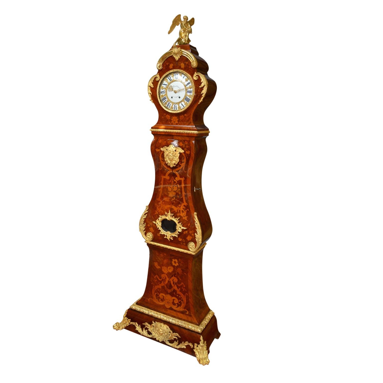 A superb quality French Louis XV style marquetry and gilt bronze longcase clock. The case of this clock is modelled after those made by the 18th century cabinetmaker Balthazar Lieutaud. The shaped marquetry oak carcass is completely veneered in
