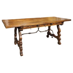 A 1900s Spanish Library Table Desk with Iron Stretchers, Shallow Frieze Drawers