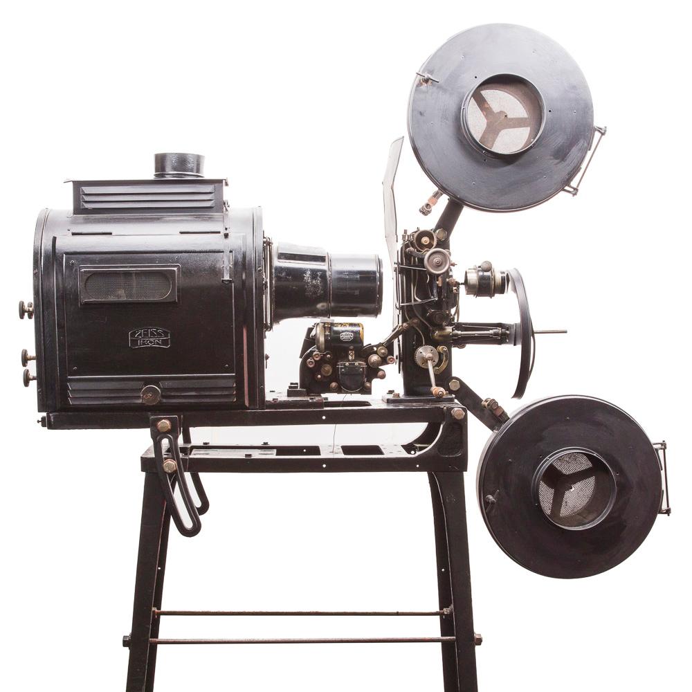 A late 1920s 35 mm Zeiss-Ikon cinema projector.

Lens: Neokino 52.5/110 by Emil Busch A.-G. Rathenow.

Original black paint.

Lamp house contains the parabolic mirror.

Provenance: Former Bornholm cinema in Denmark.


Zeiss Ikon is a