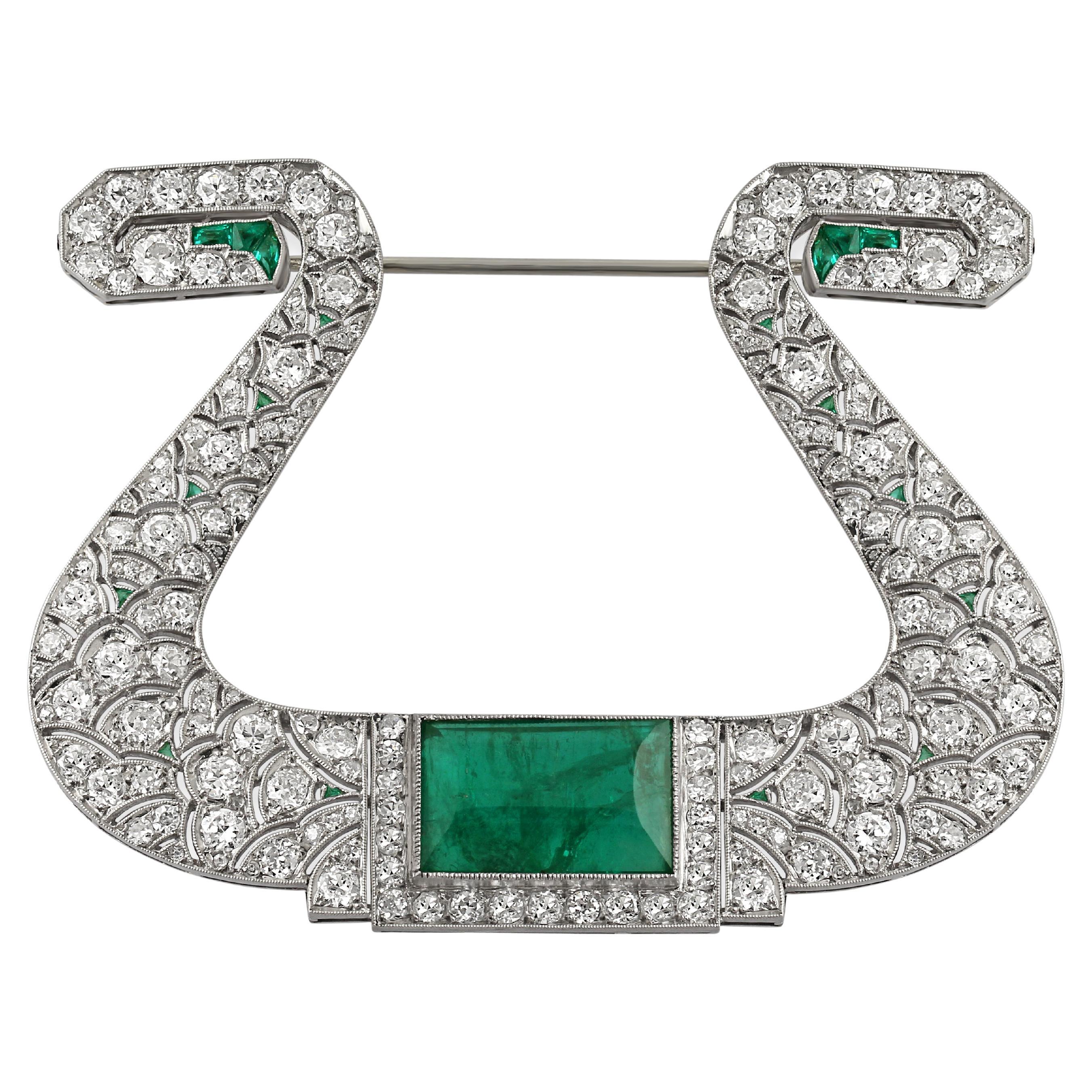 1920s Diamond 
Emerald Horseshoe Brooch For Sale